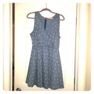 Blue wrap-style dress with flower detail